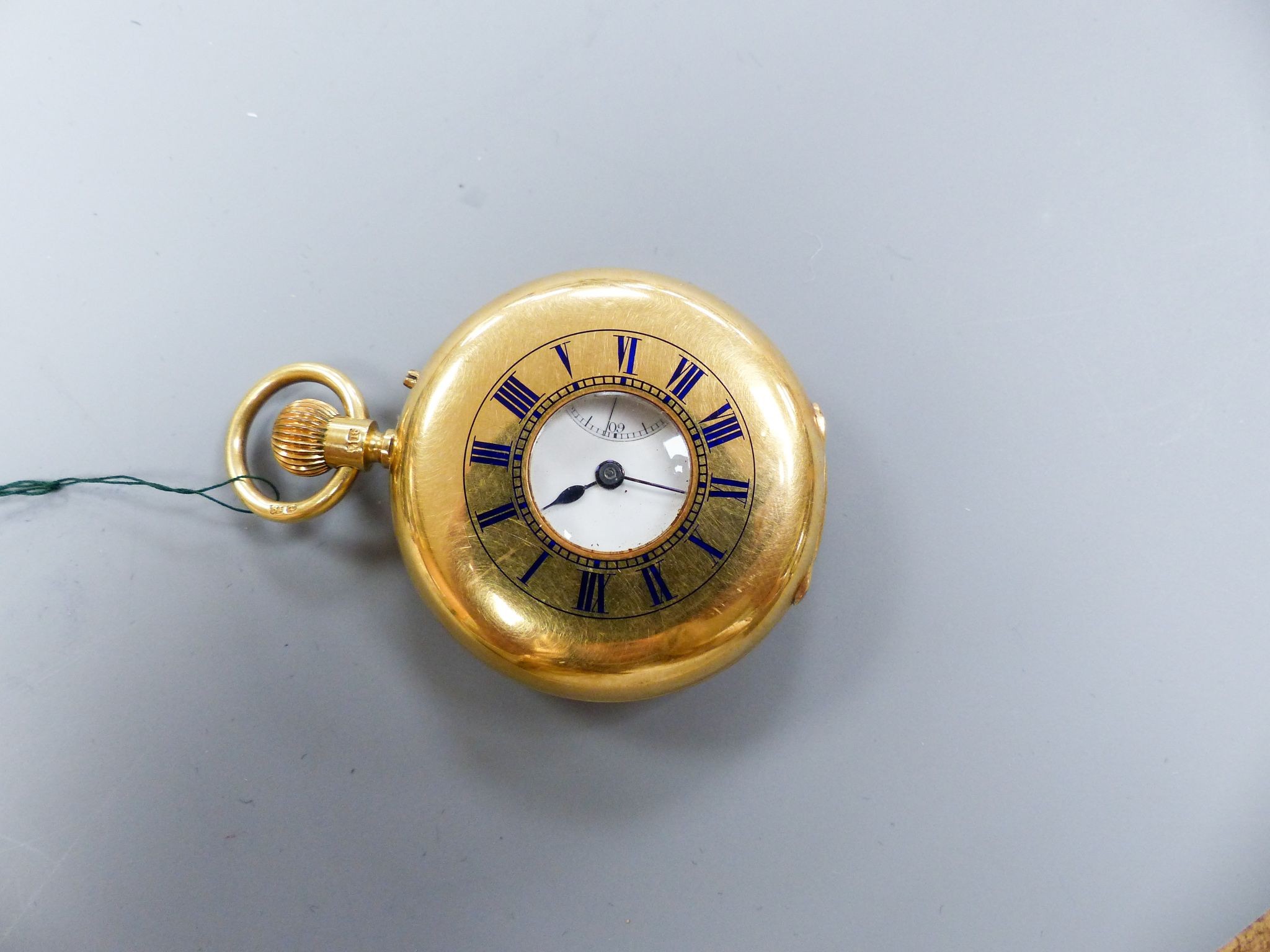 A cased late Victorian 18ct gold half hunter pocket watch, by Carrington & Co, with signed movement, case diameter 37mm, gross weight 62.1 grams, with key.